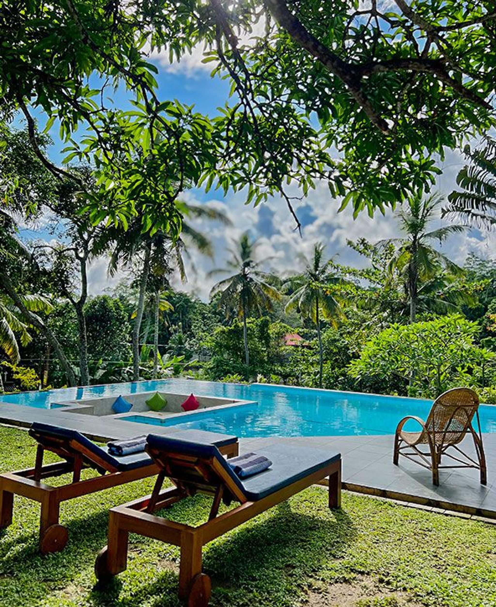Luxury poolside seating setup at Muthu Nila Villas