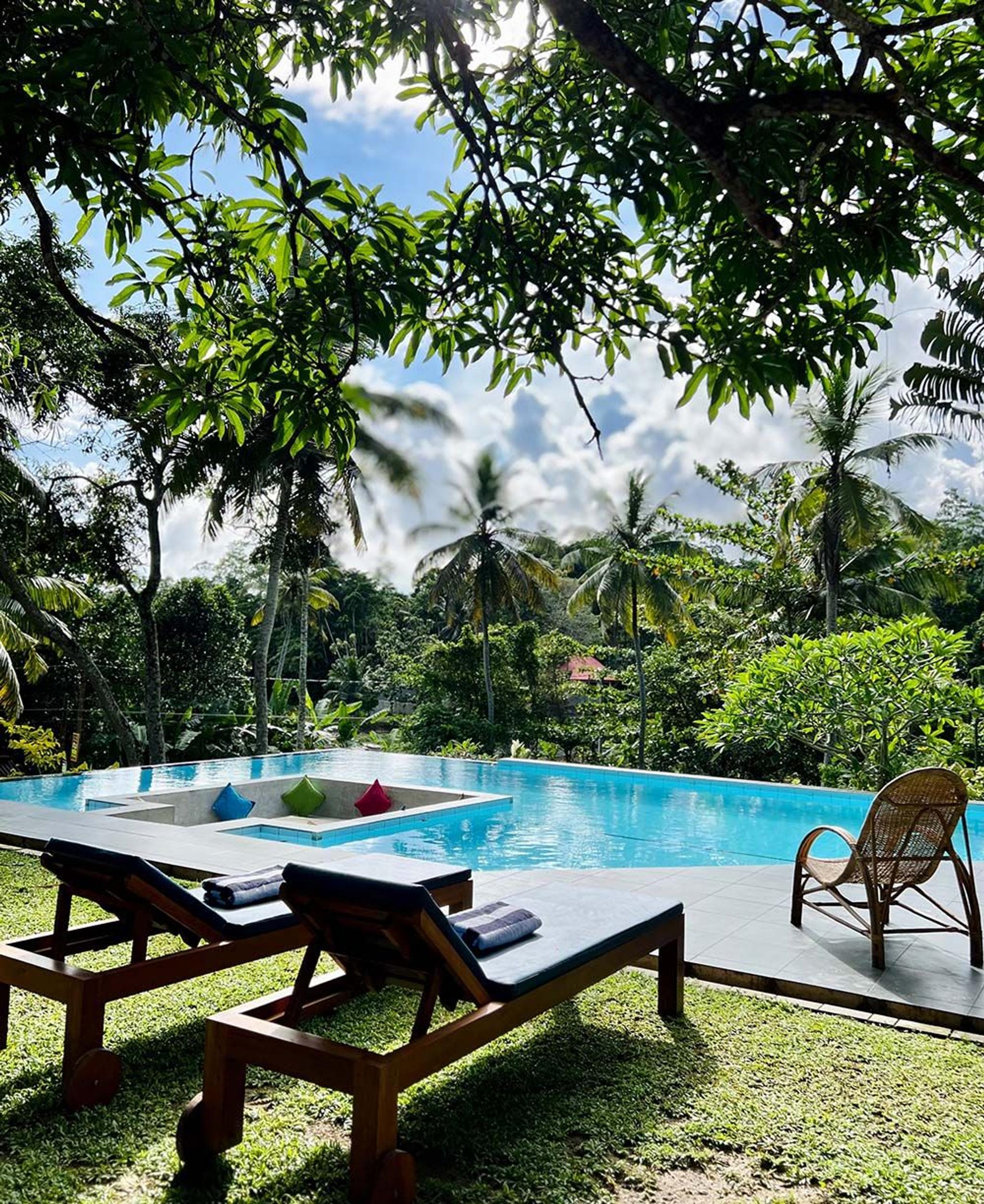 Poolside leisure and comfort seating at Muthu Nila Villas